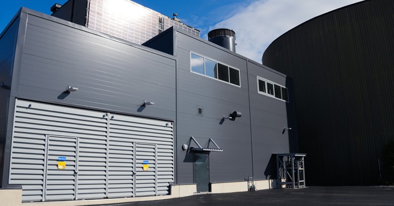 The image shows the exterior wall of the new electric boiler building in Toppila.